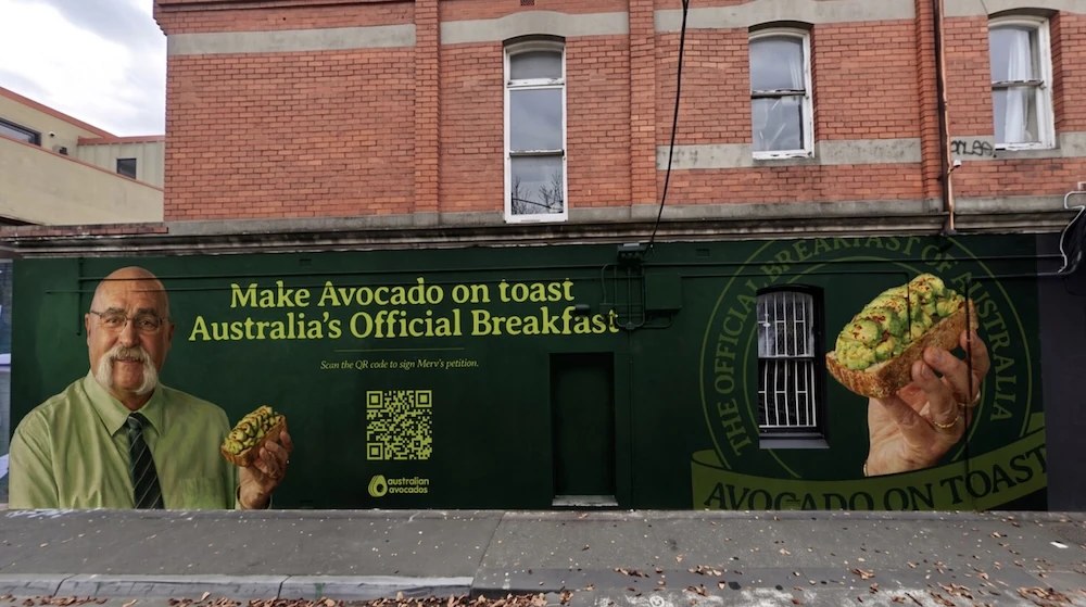 Australian Avocados PIT-TITION mural in Fitzroy featuring Merv Hughes, avocado on toast and a QR code asking people to support avocado on toast as Australia’s official breakfast.