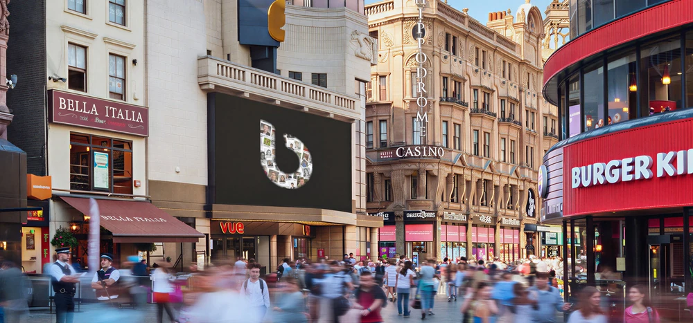 billups Day outdoor advertising in London showing the billups b created from employee portraits during the company’s global celebration.