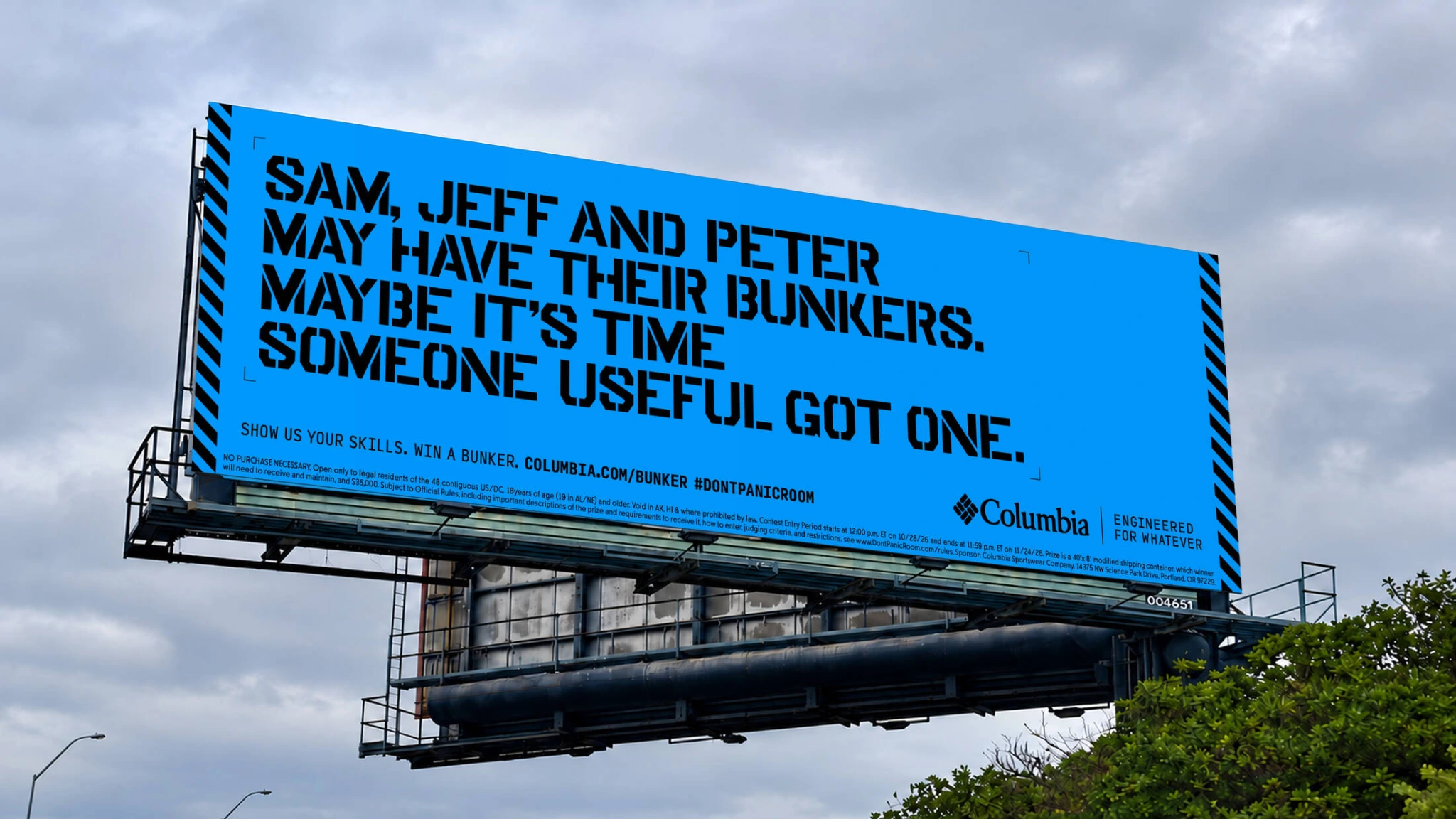 Columbia Sportswear Don’t Panic Room billboard campaign with bold blue creative challenging people to prove their survival skills.