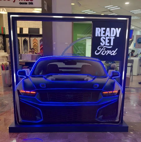 Ford Racing Mustang shopping mall activation featuring a three-dimensional illuminated vehicle front inside a custom framed OOH display.