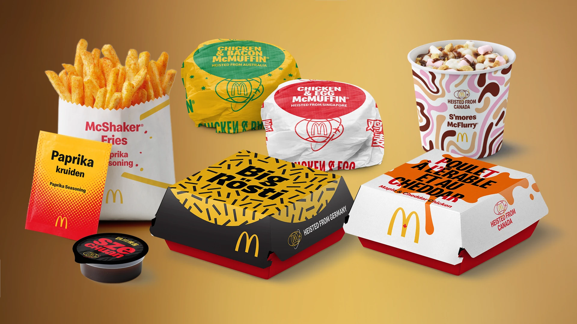 McDonald’s World Menu Heist packaging featuring international menu items including Big Rösti, Maple and Cheddar Chicken, McFlurry, McMuffin and seasoned fries.