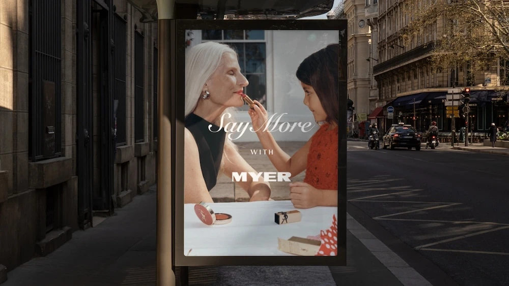 Myer Say More with Myer street furniture campaign showing a grandmother and granddaughter sharing a beauty moment.