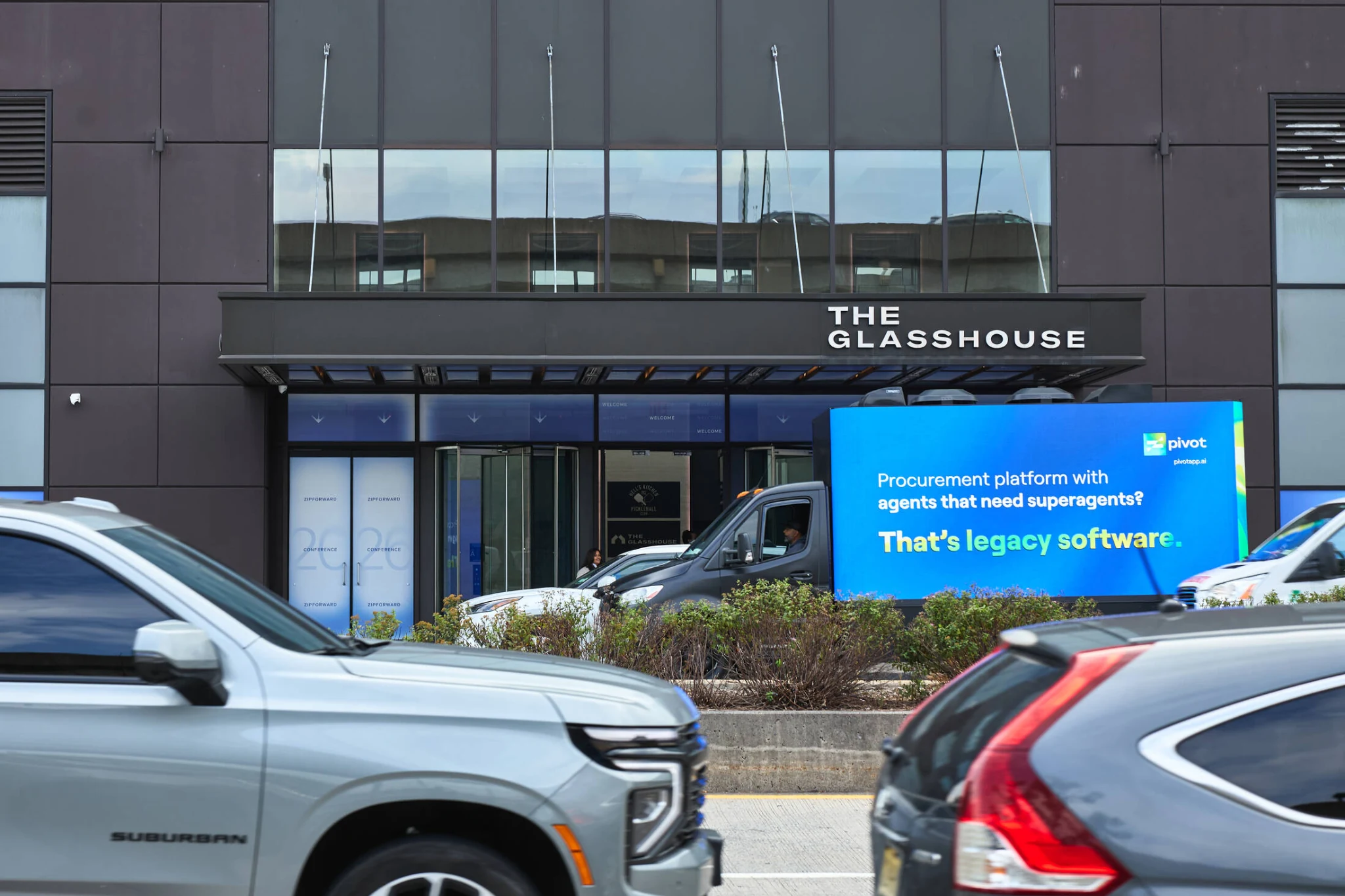 Pivot digital billboard truck outside The Glasshouse in New York displaying a The Legacy Origin Story message during Zip Forward.