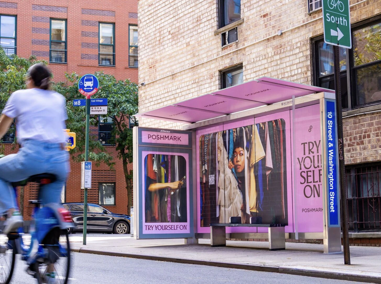 Pink Poshmark Try Yourself On bus shelter advertisement featuring fashion imagery and a wardrobe-inspired creative treatment.