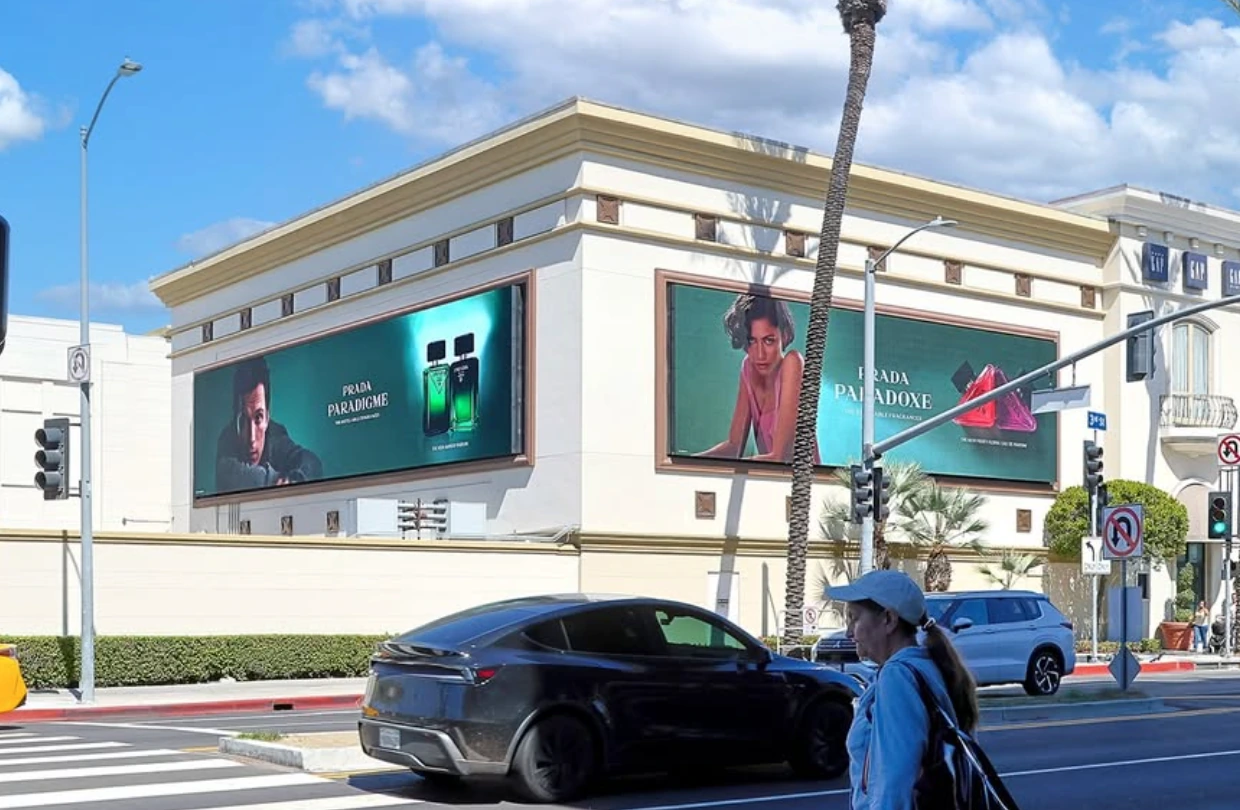 Prada Paradoxe and Prada Paradigme large-format fragrance billboards displayed together at The Grove in Los Angeles.