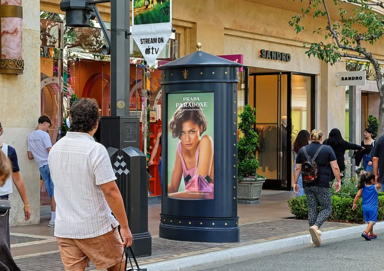 Second Prada Paradoxe kiosk execution at The Grove showing the fragrance campaign within the luxury shopping environment.