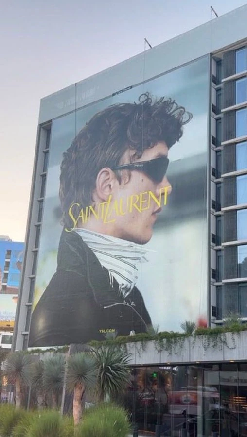 Saint Laurent Fall 2026 large-format OOH wall featuring Connor Storrie at W. Houston Street and W. Broadway in SoHo, New York City.