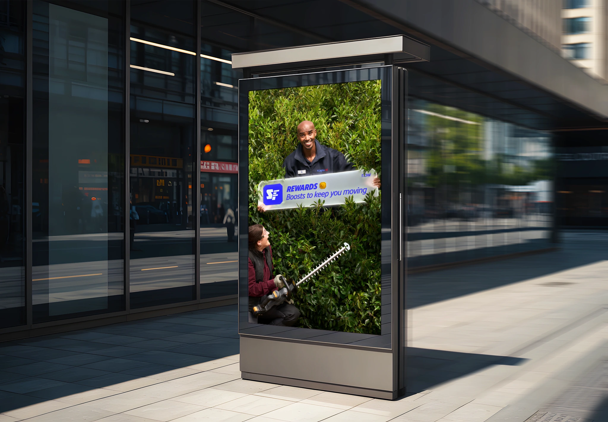 Screwfix Rewards outdoor creative showing Sir Mo Farah emerging from a hedge while presenting a rewards notification.