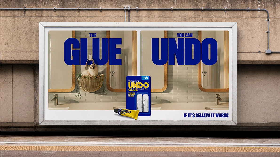 Selleys Undo Glue billboard featuring a cat in a hanging basket with the line The glue you can undo.