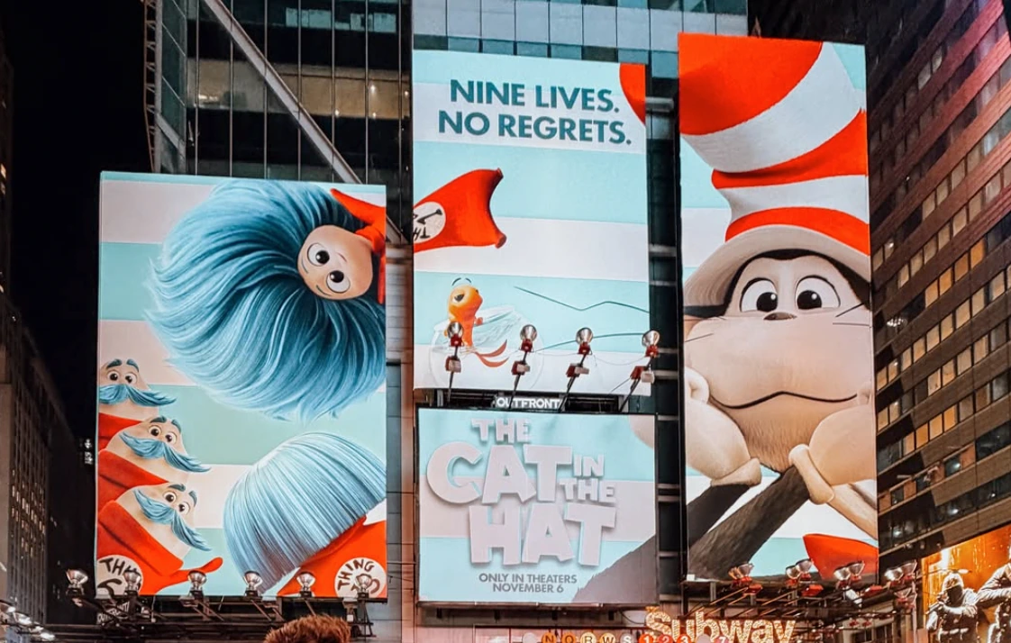 Vertical Times Square billboards for The Cat in the Hat Movie featuring the line Nine Lives. No Regrets. and a November 6 theatrical release.