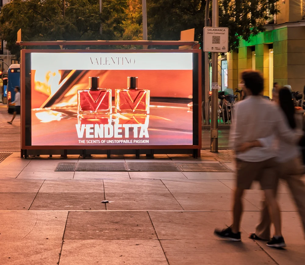 Large-format Valentino Vendetta OOH display showing two fragrance bottles with the message The Scents of Unstoppable Passion.