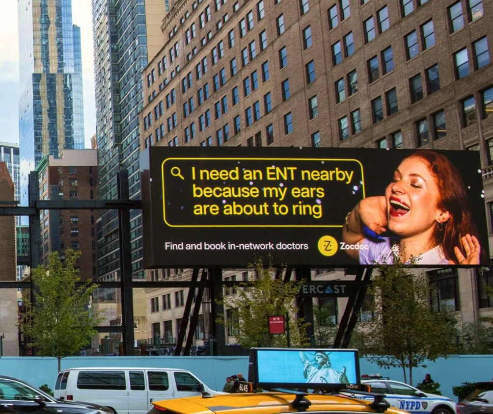 Zocdoc billboard in New York featuring the search query I need an ENT nearby because my ears are about to ring.